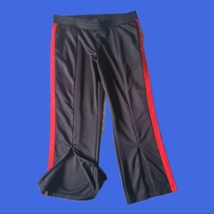Red and white striped black track pants with zipper opening in the front xl